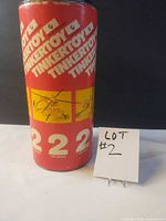 Front view of Tinkertoy No. 222 red tube canister