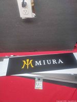 Miura vinyl sign atop stack