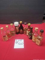 Group shot of all ten vintage mini liquor bottles showing sizes, labels and condition