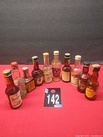 Group view of twelve vintage miniature liquor bottles