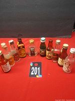 Group shot of all ten miniature liquor bottles