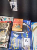 Shelf view showing Whot! card game, The Inventors board game and Disney Guess Words game