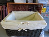 Largest basket with hinged lid open, showing liner