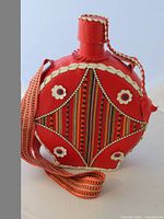 Front view showing leather wrap, decorative panel, stopper and strap