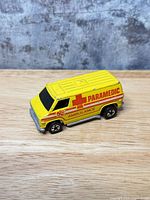 Right-front side view of Hot Wheels paramedic ambulance van showing graphics and general condition