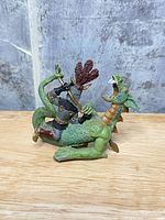 side view showing knight, dragon posture and paint detail