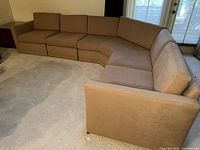 Full sectional front angle showing layout and upholstery