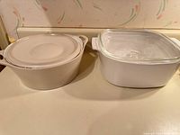 Two casserole dishes side by side showing color, shape and lids