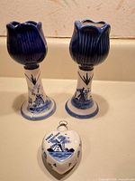 Front view of both candlesticks and heart ornament showing design details