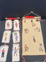 Overall view of both embroidered hangings side by side