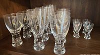 All 16 Iittala Tapio glasses in three size groups on shelf