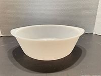 Side view of white milk glass bowl
