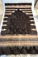 Full view of rug showing overall pattern, colors, fringe