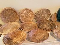 front view of grouped round wicker trays