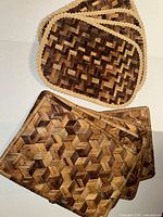 Top view of all eight placemats showing two pattern variations and braided borders