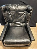 Front view of black tufted lounge chair