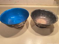 Both pedestal bowls side by side showing design and color differences.