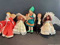 Group view of all five vintage dolls