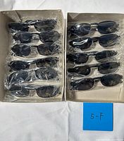 Two trays showing all wrapped sunglasses