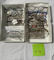 Two trays showing entire assortment of eyeglass frames