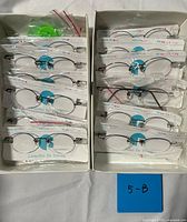 Both boxes showing all sealed eyeglass frames