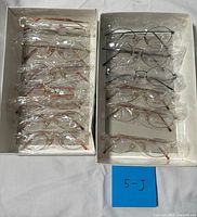 Both boxes showing twelve individually wrapped frames