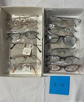 Overall view of two boxes with mixed eyeglass frames