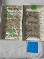 Overview of both compartments showing all rimless eyeglass frames