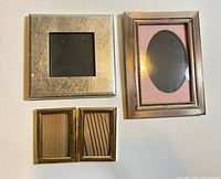 Front view of four metal frames showing style and finishes