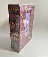 Side view of sealed stack showing four album spines