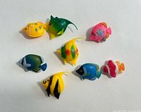 Top view of all eight plastic fish toys