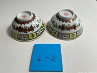 Top view showing both bowls and underside mark