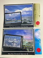 Front view of both sealed postcard sets showing cover images and header cards