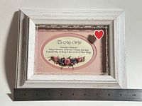 Front view with ruler showing overall size and decorative insert