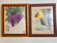 Frontal view of both framed paintings side by side