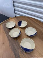 Top view of five two-tone bowls on table