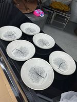 All six matching tree motif bowls displayed