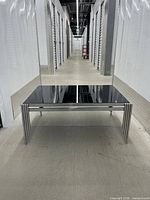 Full view of coffee table in storage corridor highlighting overall design