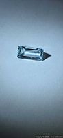 Loose light blue aquamarine gemstone, rectangular baguette shape