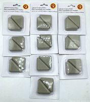 Nine of the ten sealed slider packs displayed front with $2 price and product title visible