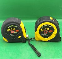 Front view of both tape measures showing brand, length, widths, and overall wear