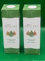 Front view of both boxed sprays