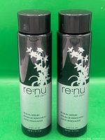 Front view of two Joico Renu Age Defy Renewal Serum bottles