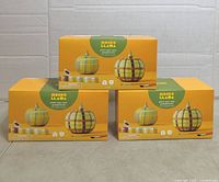 Front view of three boxed kits stacked