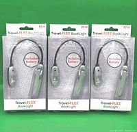 Front view showing three packaged Travel-FLEX BookLights