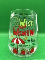 Front view of stemless wine glass showing "3 Wise Women" graphic