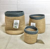 Front view of all three Alkaso jute baskets displaying sizes and tags