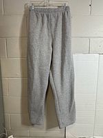 Full front view of grey jogging pants hanging