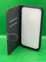 Interior view showing card slots, phone compartment with foam insert