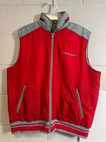 Front view of red and grey Mega Sport sleeveless vest showing full zipper, pockets and hem